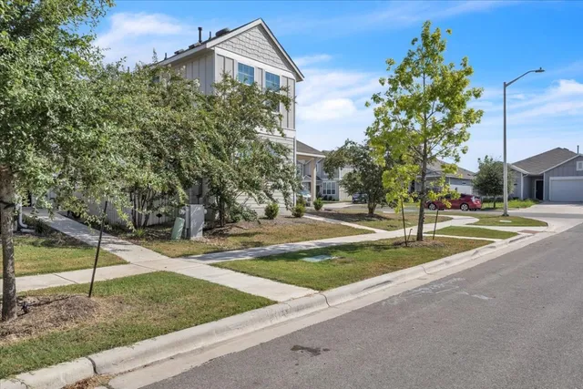 a view of a house with basketball court