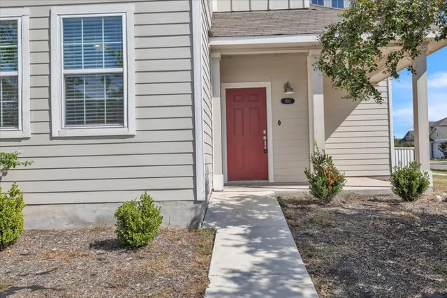 a view of a pathway besides a house