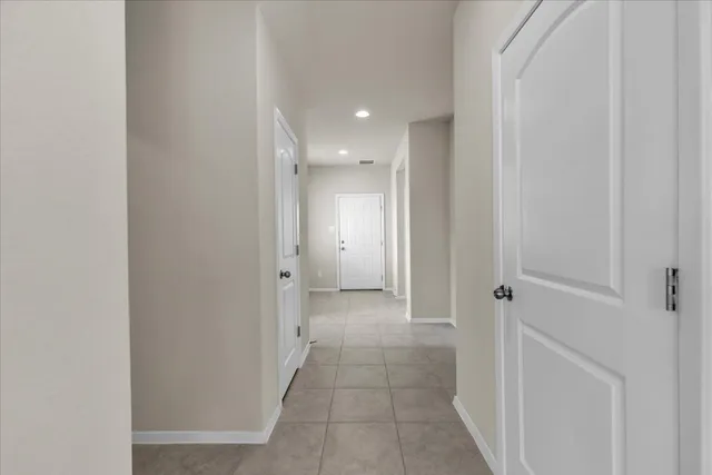 a view of a hallway with a room