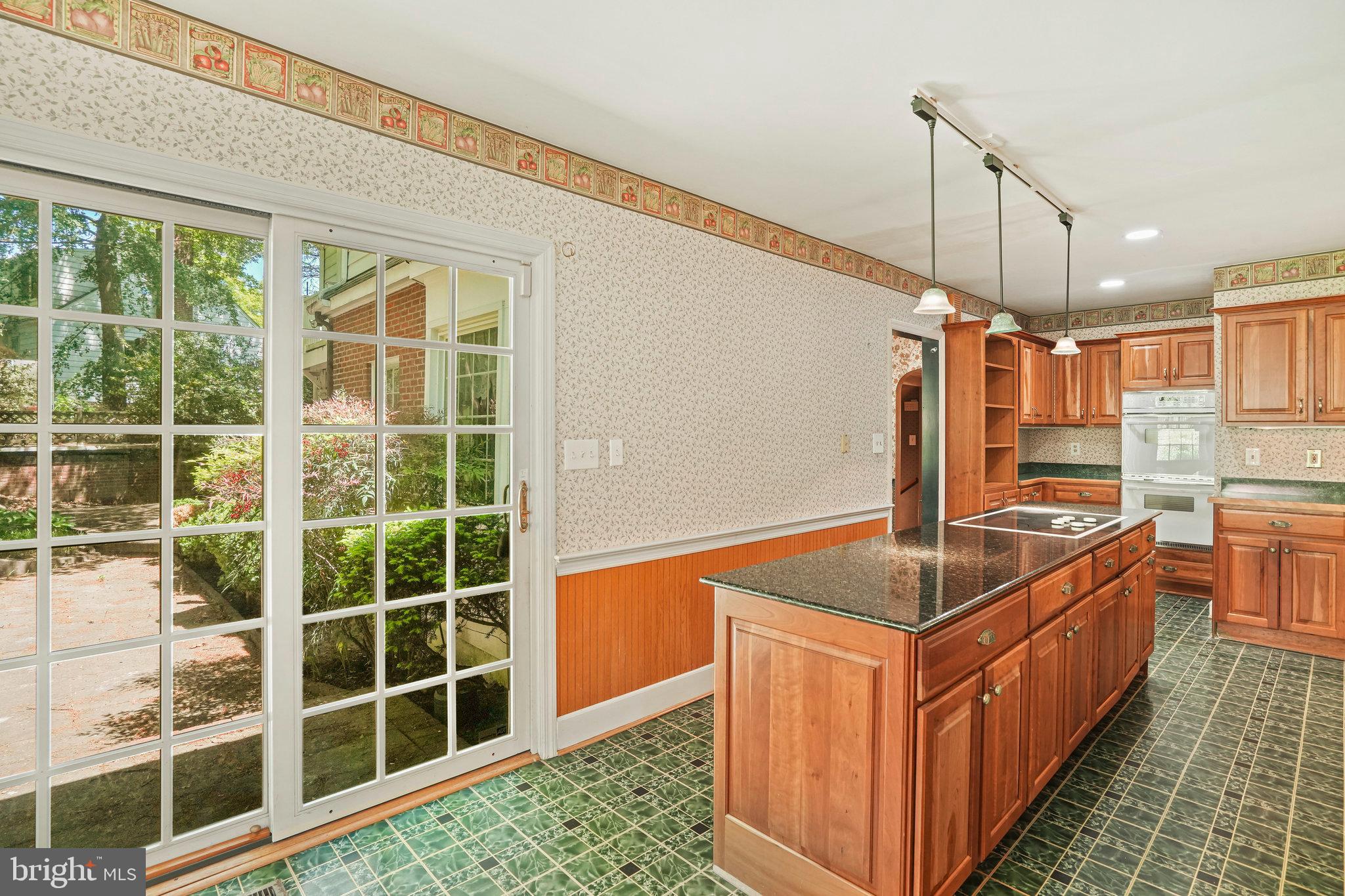 6900 Wake Forest Drive College Park, MD 20740 - Photo 14 of 50 Walk out to the backyard from the kitchen