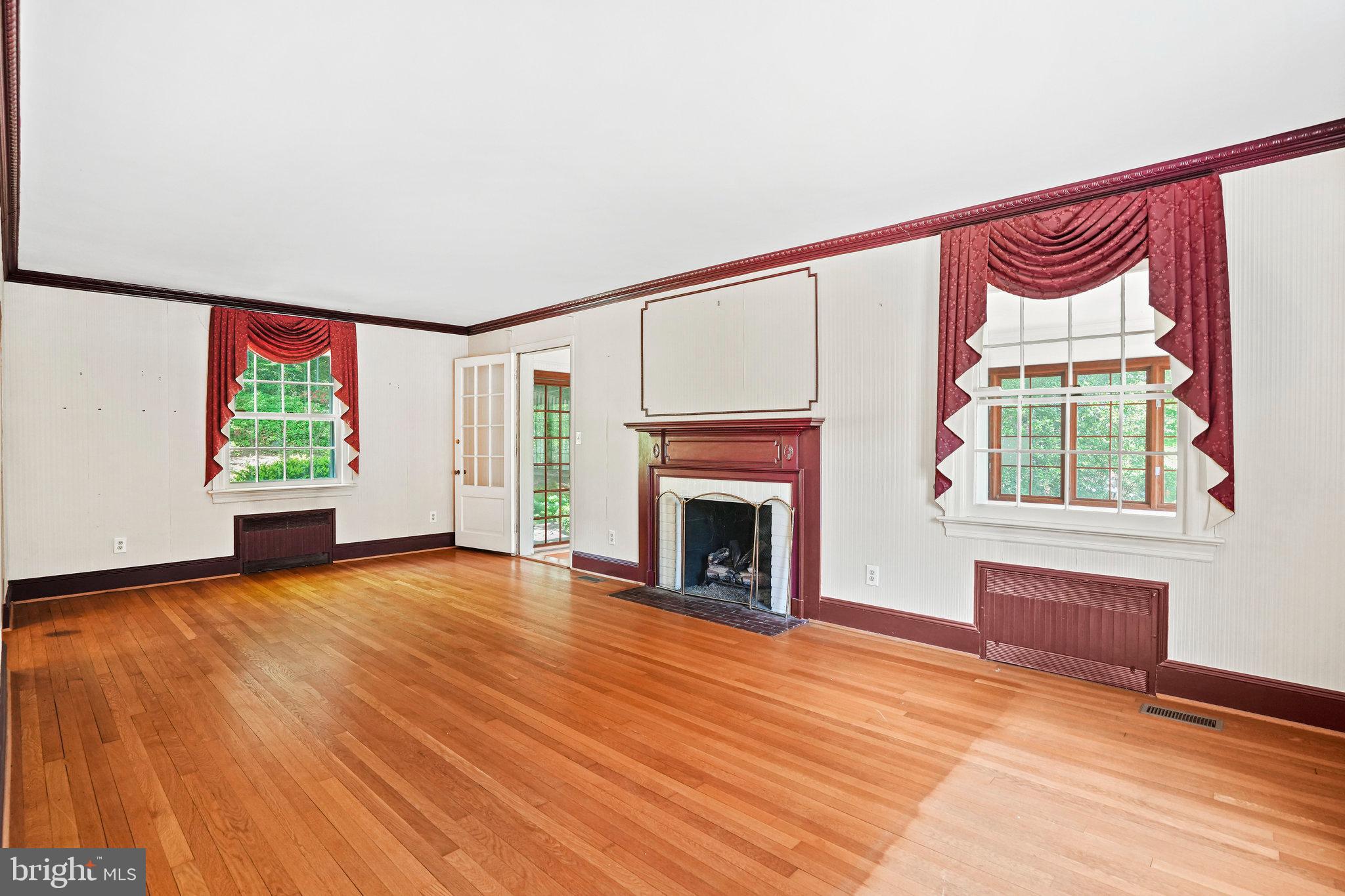 6900 Wake Forest Drive College Park, MD 20740 - Photo 19 of 50 Large living room with a fireplace