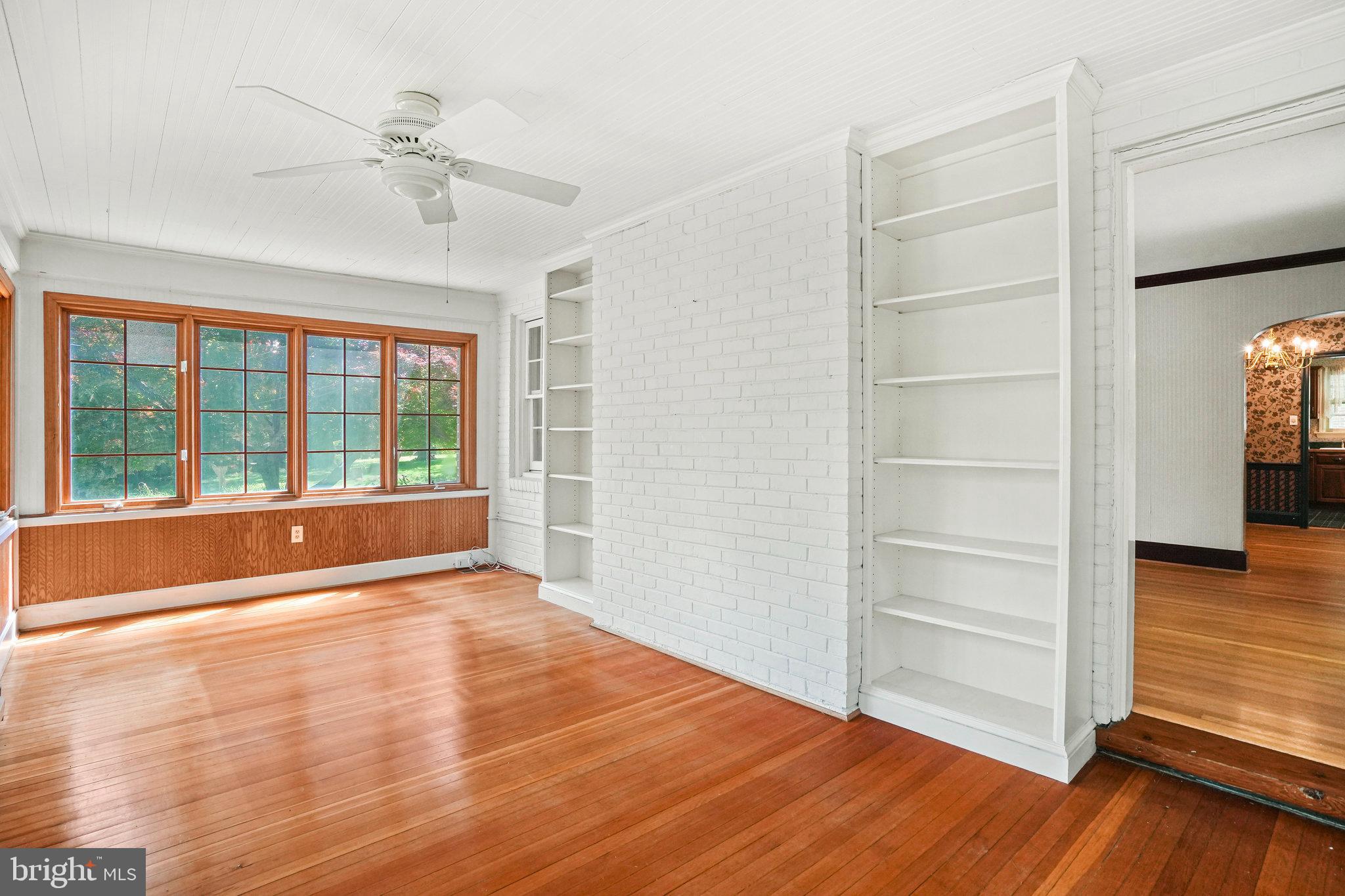 6900 Wake Forest Drive College Park, MD 20740 - Photo 21 of 50 Bright sunroom with built in bookshelves