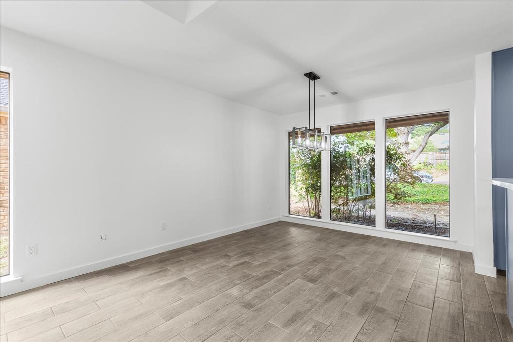 17003 Davenport Road Dallas, TX 75248 - Photo 12 of 40 a view of an empty room with windows and outdoor space