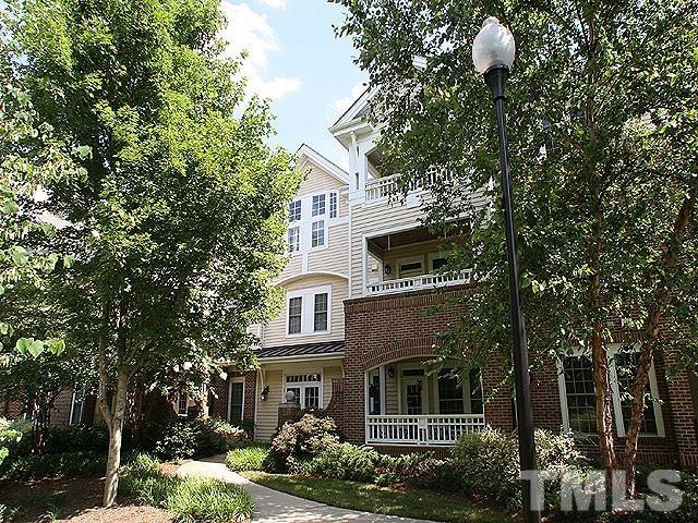 100 Northbrook Drive, Unit 203 Raleigh, NC 27609 - Photo 1 of 39 a front view of a house with a garden