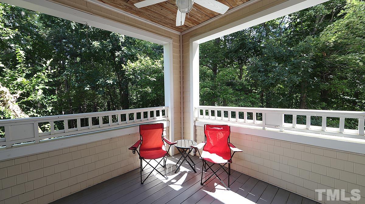 100 Northbrook Drive, Unit 203 Raleigh, NC 27609 - Photo 18 of 39 a view of a balcony with chairs