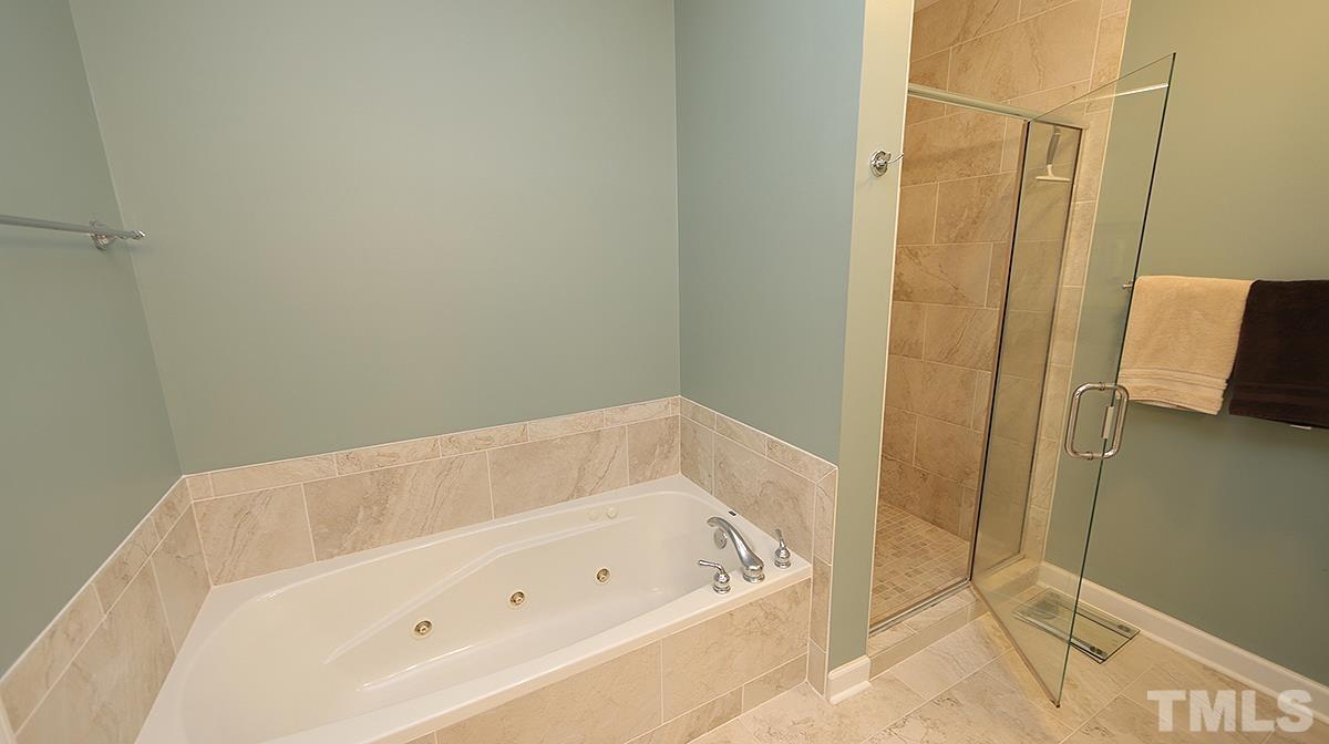 100 Northbrook Drive, Unit 203 Raleigh, NC 27609 - Photo 24 of 39 a bathroom with a tub and shower