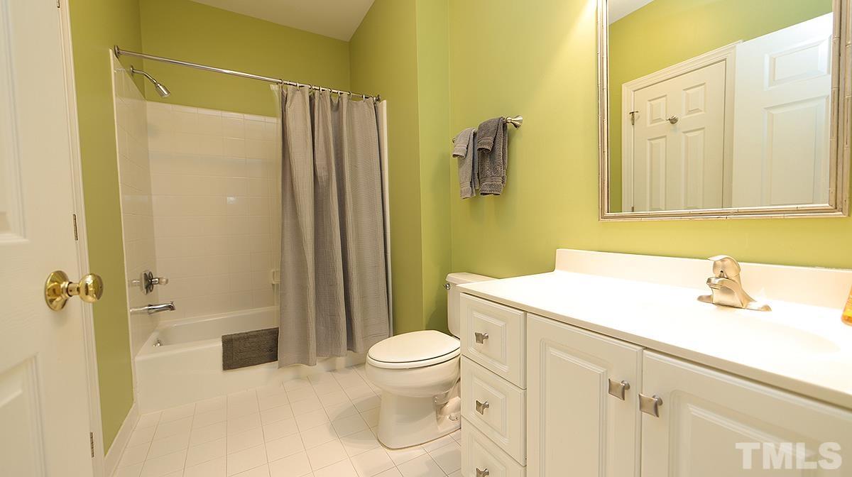 100 Northbrook Drive, Unit 203 Raleigh, NC 27609 - Photo 26 of 39 a bathroom with a sink a toilet and shower