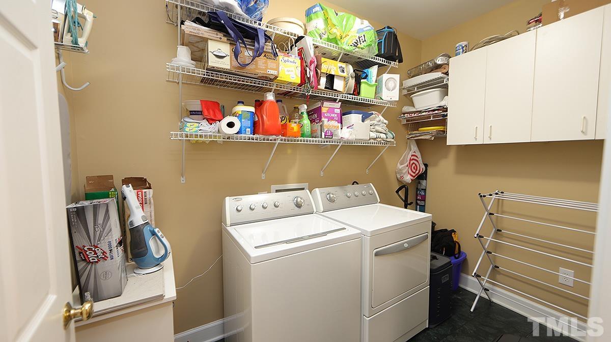 100 Northbrook Drive, Unit 203 Raleigh, NC 27609 - Photo 28 of 39 a utility room with dryer and washer
