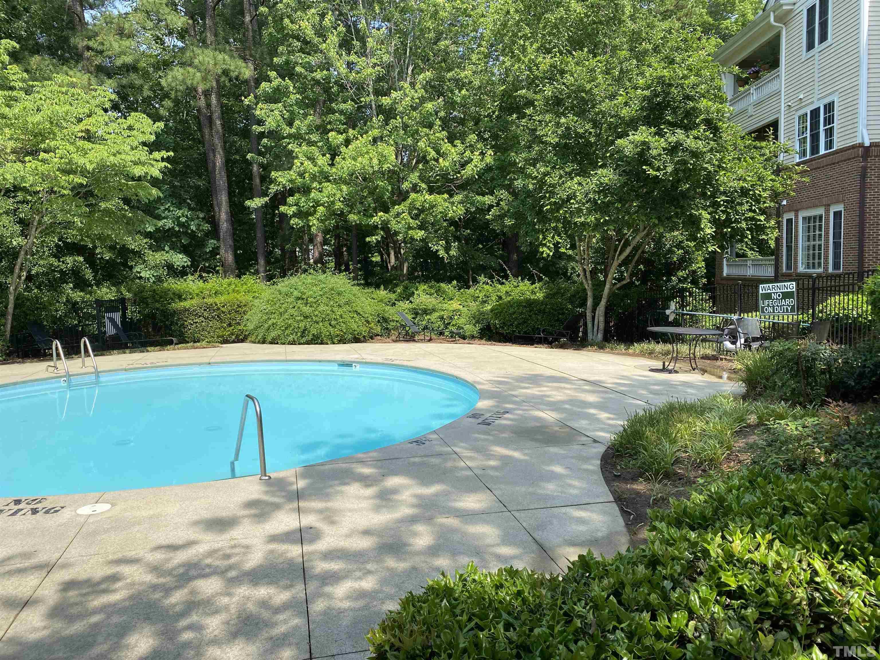 100 Northbrook Drive, Unit 203 Raleigh, NC 27609 - Photo 33 of 39 a view of a swimming pool with a yard