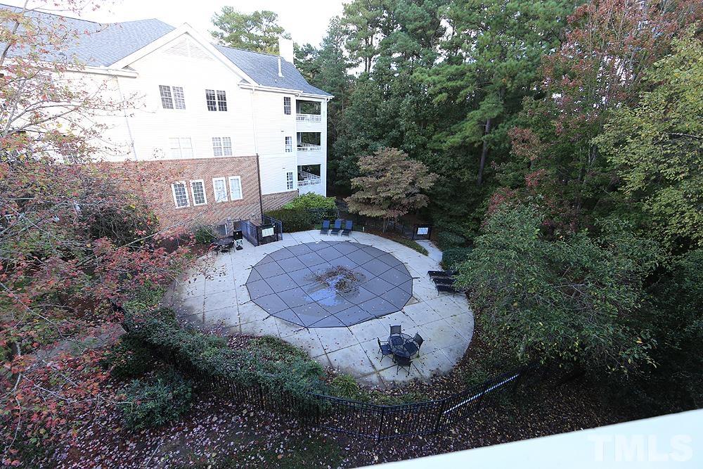 100 Northbrook Drive, Unit 203 Raleigh, NC 27609 - Photo 34 of 39 a view of a house with a yard and sitting area