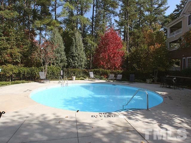 100 Northbrook Drive, Unit 203 Raleigh, NC 27609 - Photo 35 of 39 a view of a swimming pool with an outdoor space and seating area