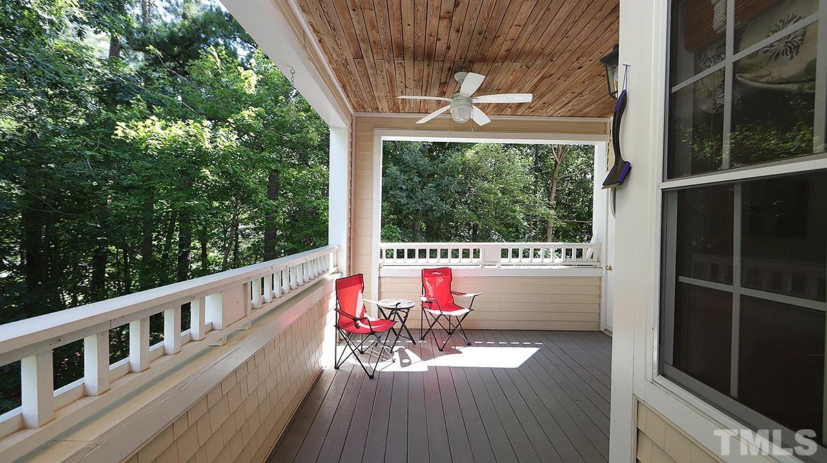 100 Northbrook Drive, Unit 203 Raleigh, NC 27609 - Photo 6 of 39 a view of balcony with wooden floor and outdoor seating