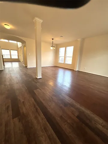 a view of entryway with wooden floor