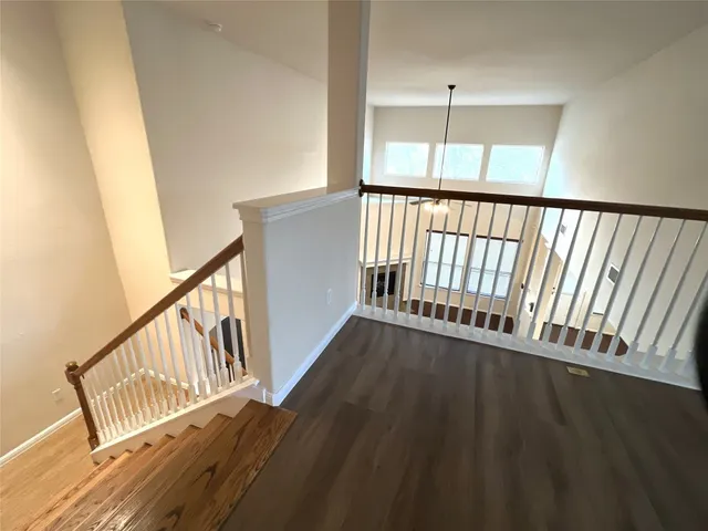 a view of staircase with wooden floor and stairs