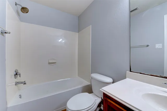 a bathroom with a sink toilet and a bathtub