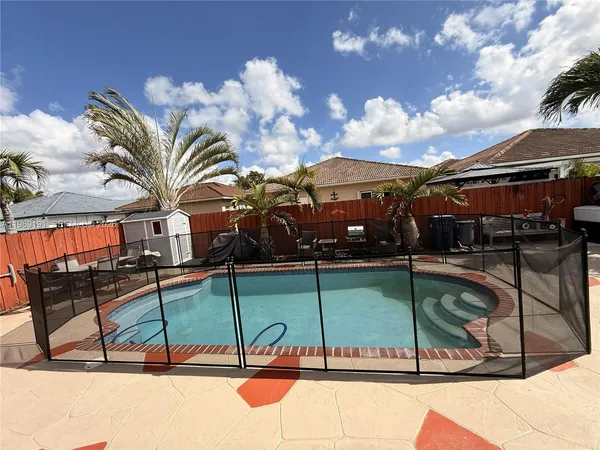 a view of a swimming pool with a lounge chair