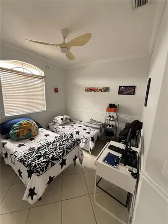 a bed room with bed and a window