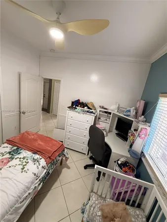 a bedroom with a bed and balcony