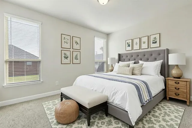 a bedroom with a bed and glass windows