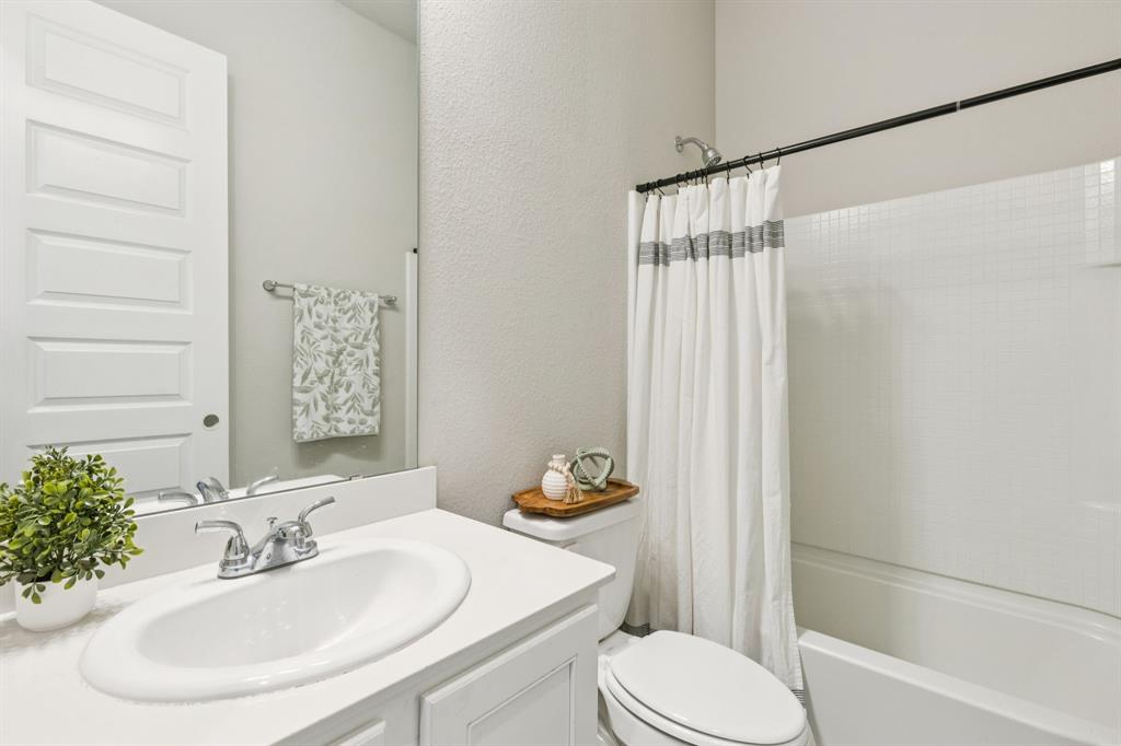 1222 El Sol Boulevard Sherman, TX 75090 - Photo 23 of 39 a bathroom with a sink toilet and shower