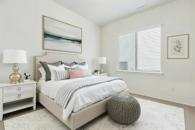 a bedroom with a bed and a couch