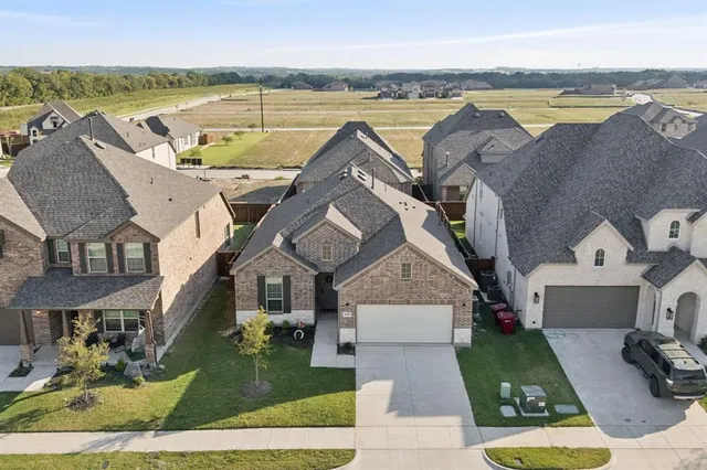 an aerial view of a house with a garden