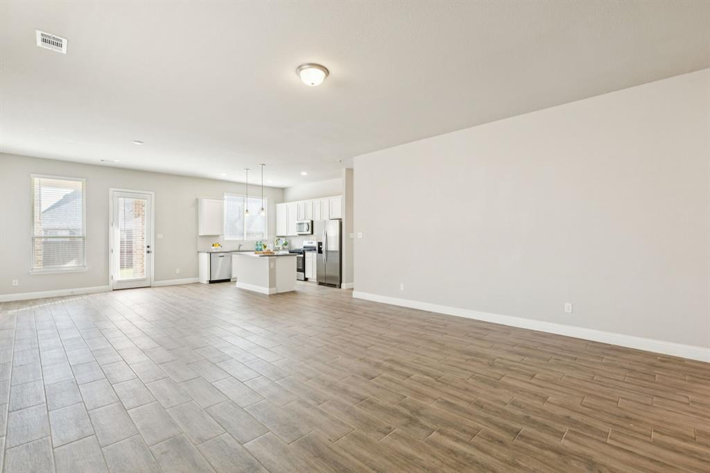 1222 El Sol Boulevard Sherman, TX 75090 - Photo 4 of 39 a view of empty room with wooden floor