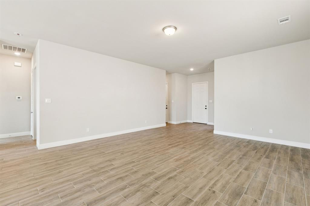 1222 El Sol Boulevard Sherman, TX 75090 - Photo 5 of 39 a view of an empty room with wooden floor
