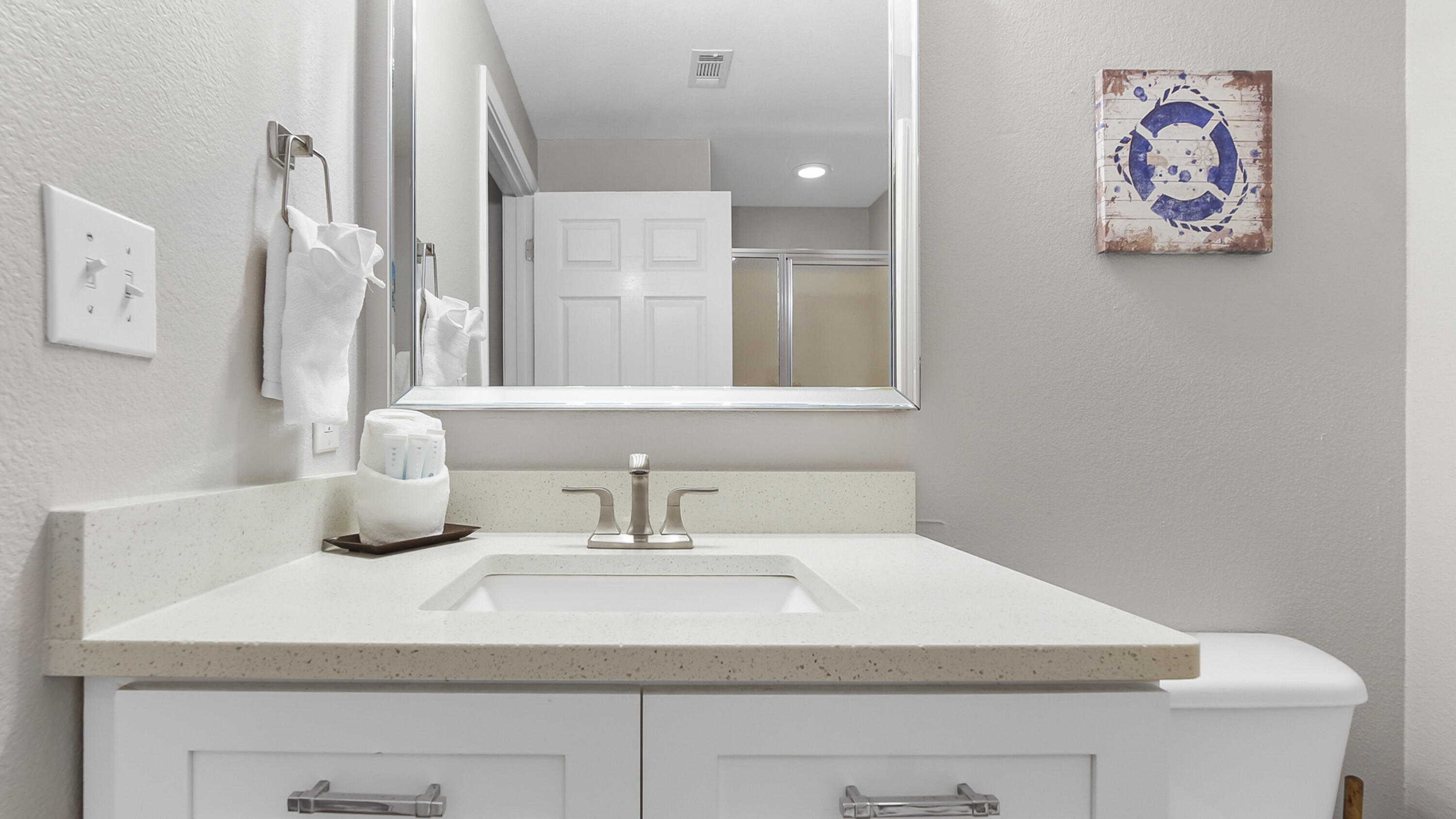 16819 Front Beach Road, Unit 2214 Panama City Beach, FL 32413 - Photo 24 of 49 a bathroom with a sink and a mirror