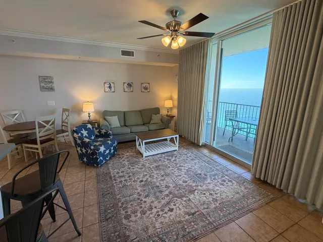 a living room with furniture and a rug