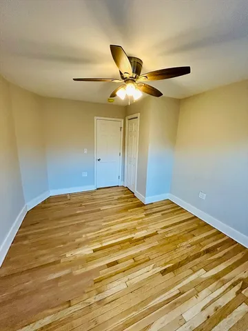 a view of a big room with wooden floor