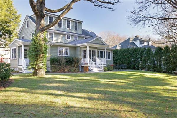 151 Plymouth Road Newton, MA 02461 - Photo 2 of 12 a front view of a house with a garden