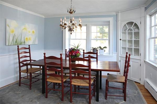 151 Plymouth Road Newton, MA 02461 - Photo 5 of 12 a view of a dining room with furniture a chandelier and wooden floor