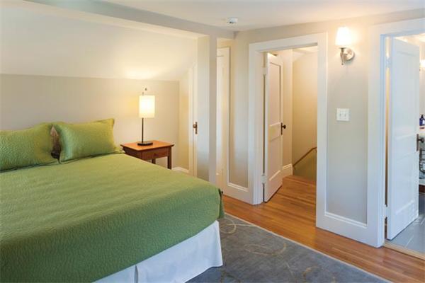 151 Plymouth Road Newton, MA 02461 - Photo 10 of 12 a bedroom with a bed and wooden floor