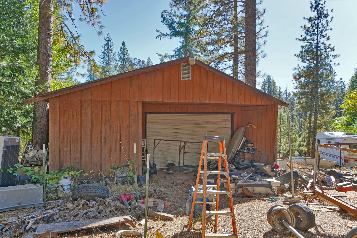 6128 Scott Road Placerville, CA 95667 - Photo 4 of 13 a front view of house with yard outdoor seating and green space