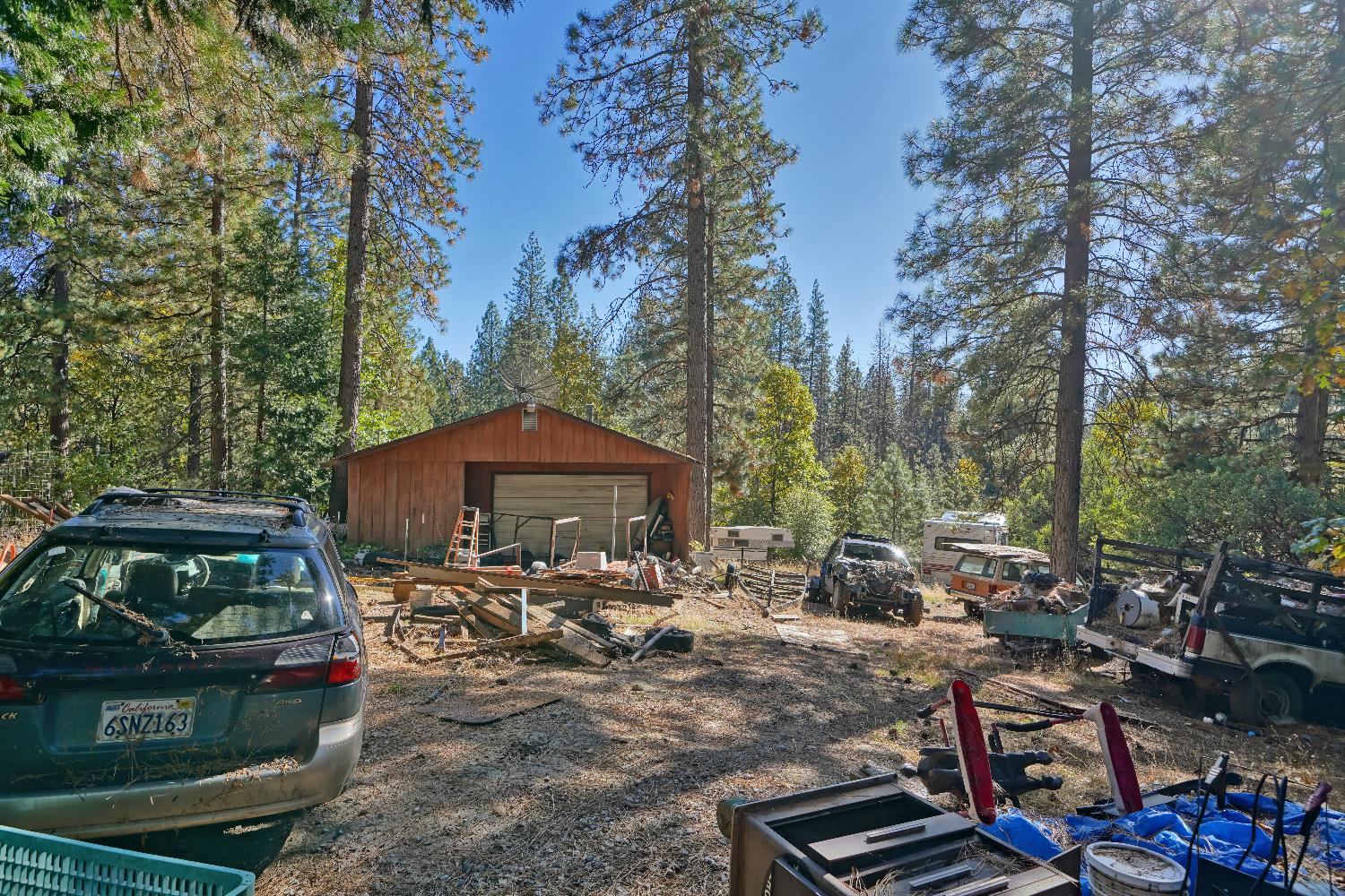 6128 Scott Road Placerville, CA 95667 - Photo 6 of 13 a view of a patio with table and chairs under an umbrella