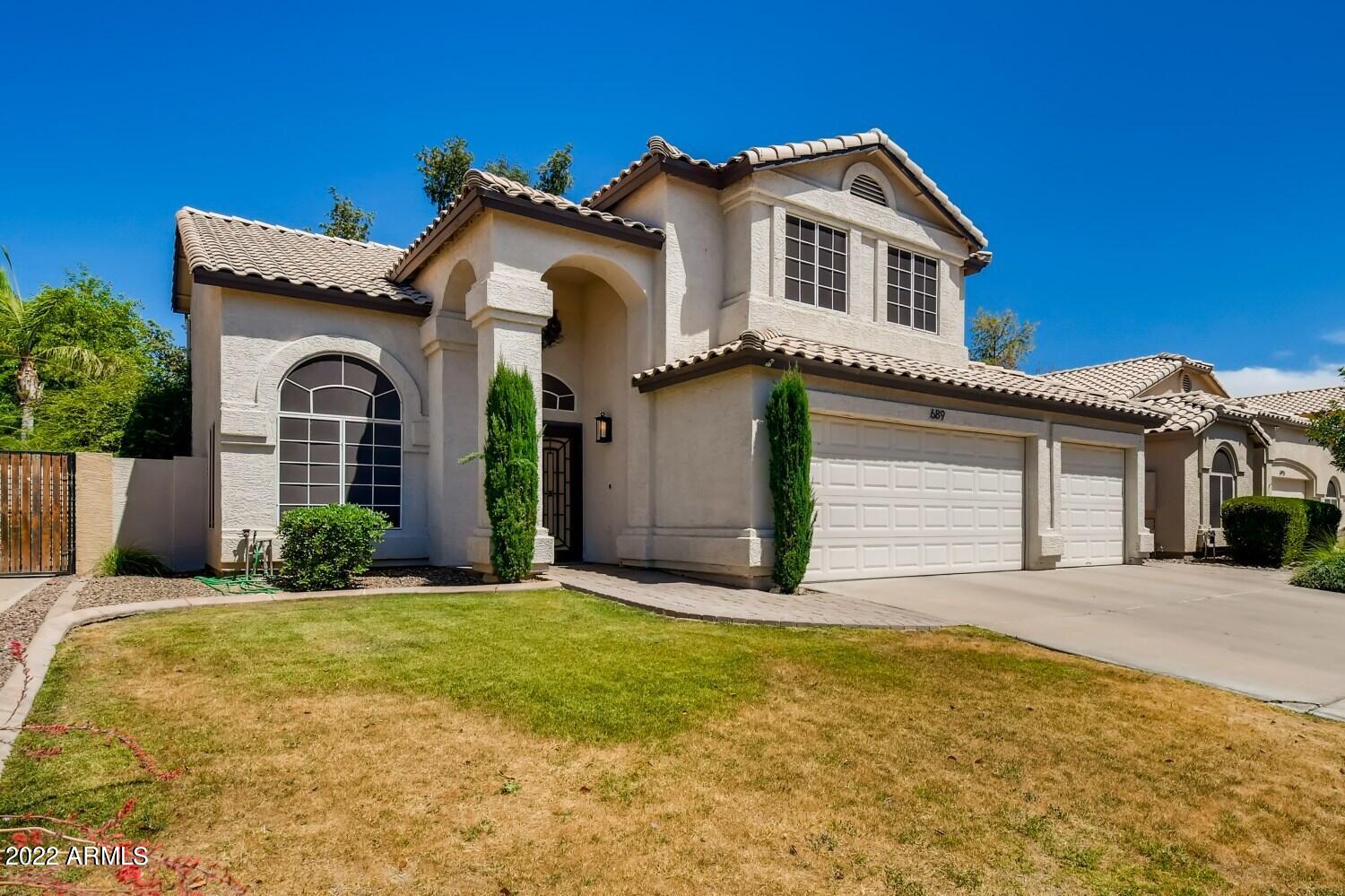 a front view of a house with yard