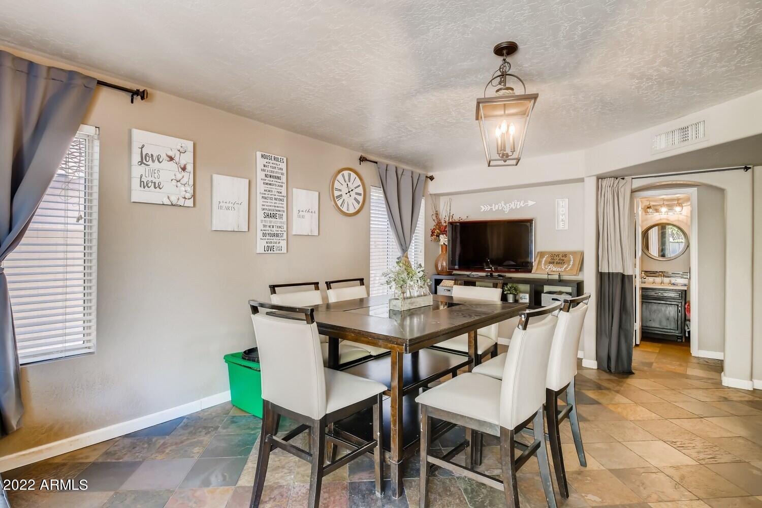 689 South Dodge Street Gilbert, AZ 85233 - Photo 11 of 28 a view of a dining room with furniture