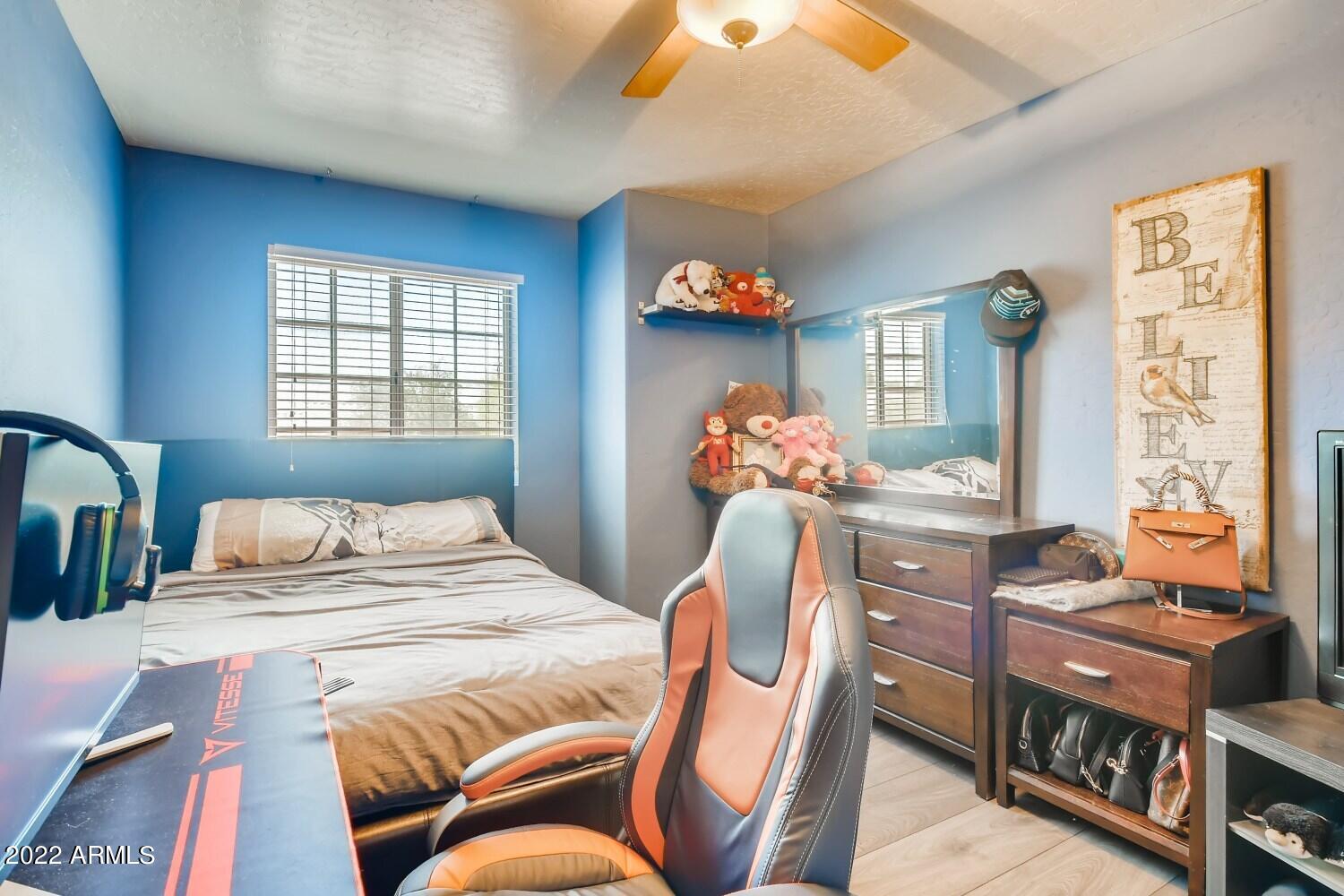 689 South Dodge Street Gilbert, AZ 85233 - Photo 16 of 28 a bedroom with furniture and a window