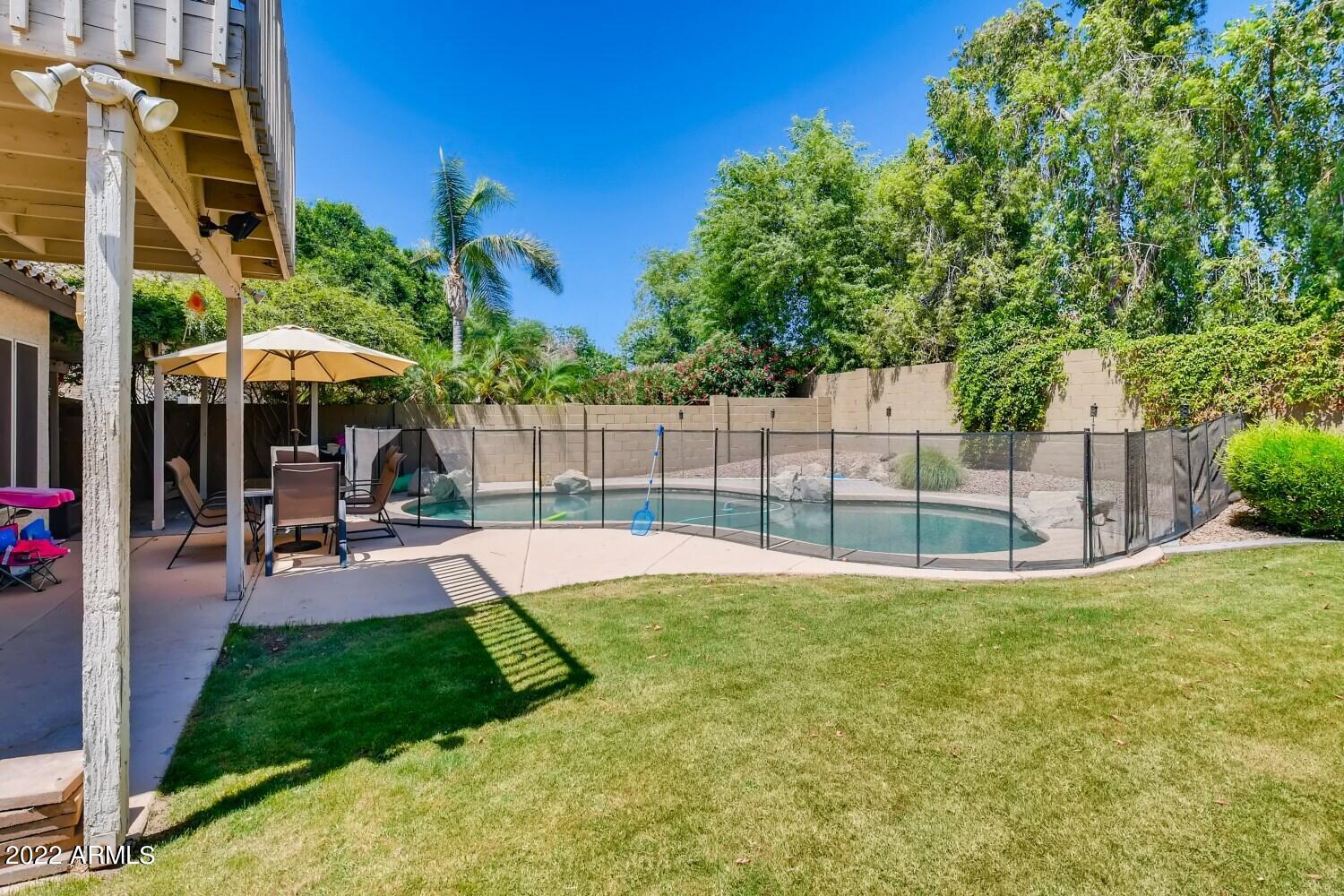 689 South Dodge Street Gilbert, AZ 85233 - Photo 21 of 28 a view of a backyard with a patio
