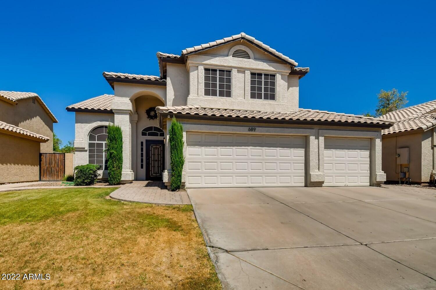 689 South Dodge Street Gilbert, AZ 85233 - Photo 28 of 28 a front view of a house with a yard