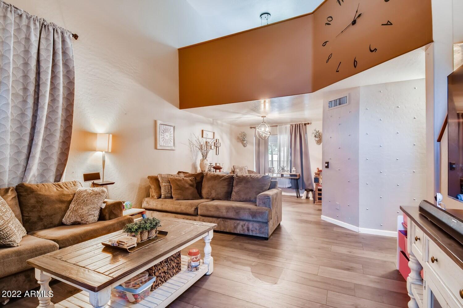 689 South Dodge Street Gilbert, AZ 85233 - Photo 8 of 28 a living room with furniture and wooden floor