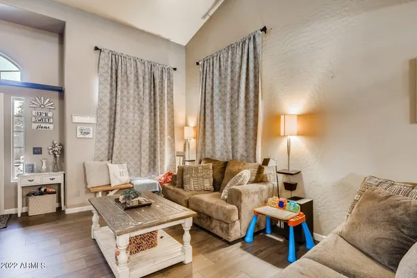 a living room with furniture and a window