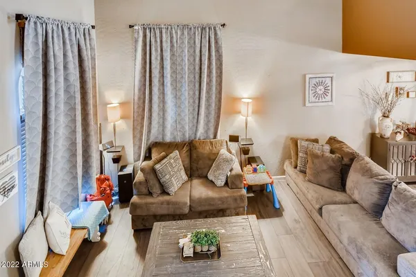 a living room with furniture and a large window