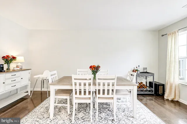 a view of a dining room with furniture and window