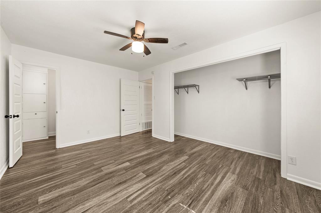 104 East Santa Anna Street Robinson, TX 76706 - Photo 26 of 36 a view of an empty room with wooden floor