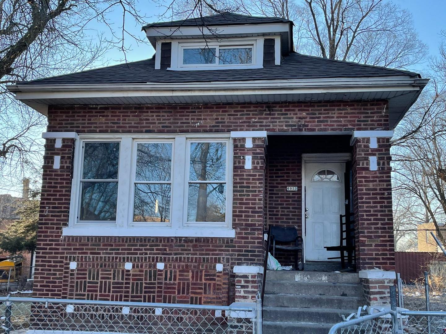 6950 South Carpenter Street Chicago, IL 60621 - Photo 1 of 3 a front view of a house