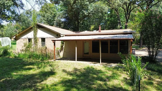 a house with trees in the background
