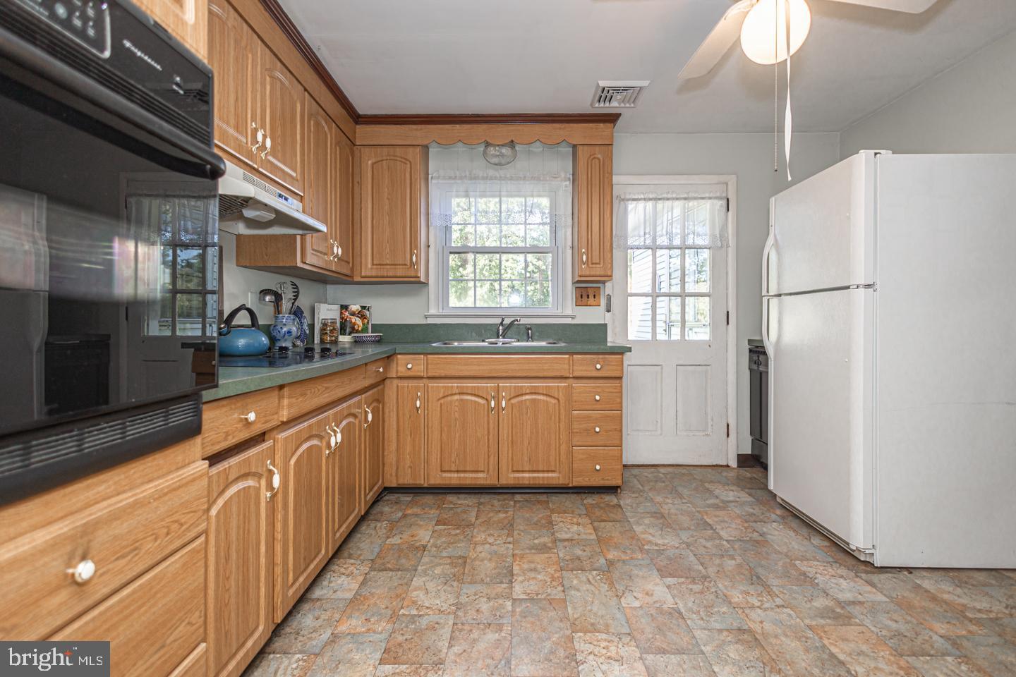 54 Eagle Road Newtown, PA 18940 - Photo 14 of 31 a large kitchen with a cabinets and a refrigerator