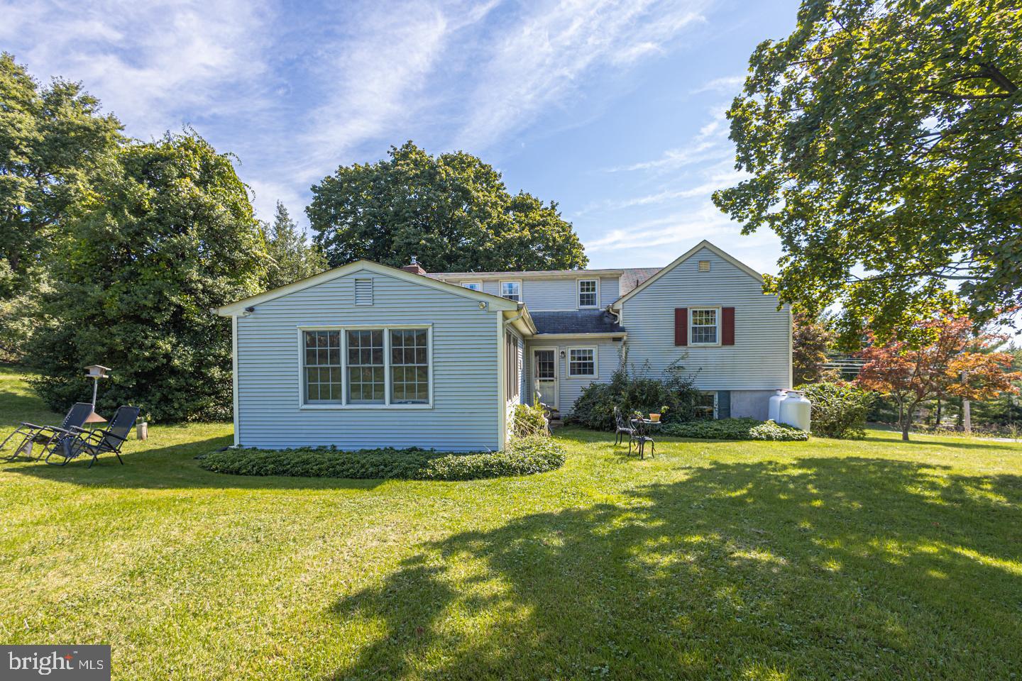 54 Eagle Road Newtown, PA 18940 - Photo 24 of 31 a front view of house with yard and trees in the background